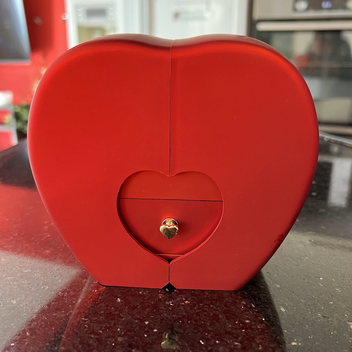 Closed red heart box with a heart shaped drawer