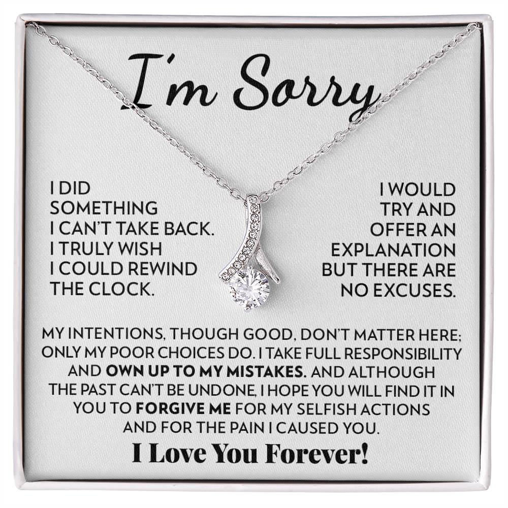 Ribbon pendant necklace in 14k white gold finish on the "I'm Sorry" message card for her