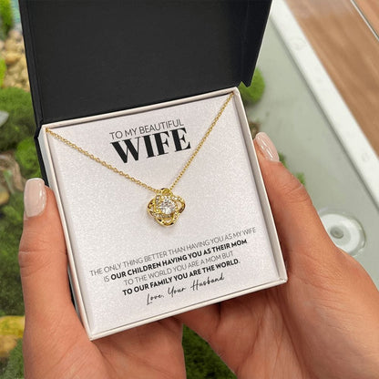 Love knot pendant necklace in 18k yellow gold finish with the "To My Beautiful Wife" message card from husband, in the two tone soft touch box