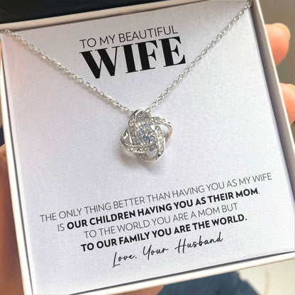 Love knot pendant necklace in 14k white gold finish on the "To My Beautiful Wife" message card from husband