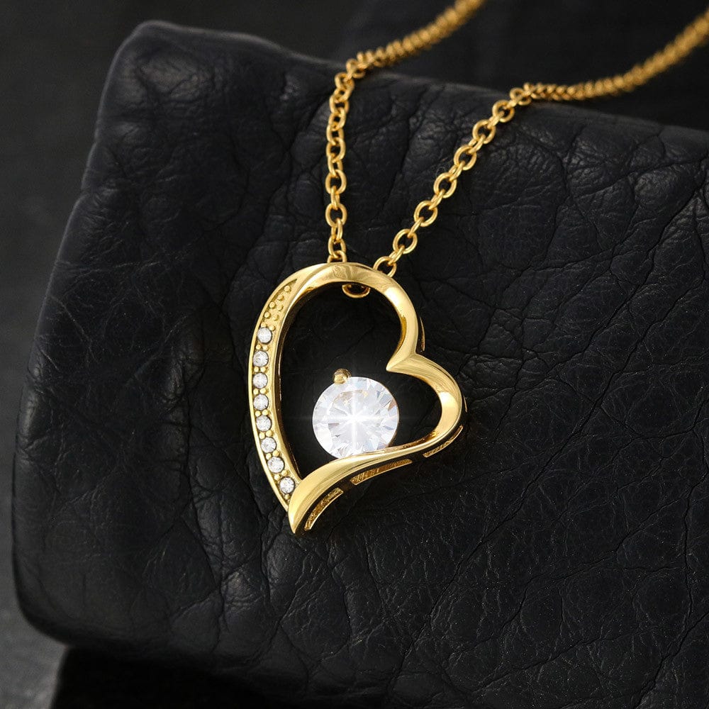 Close up of the heart pendant in 18k yellow gold finish