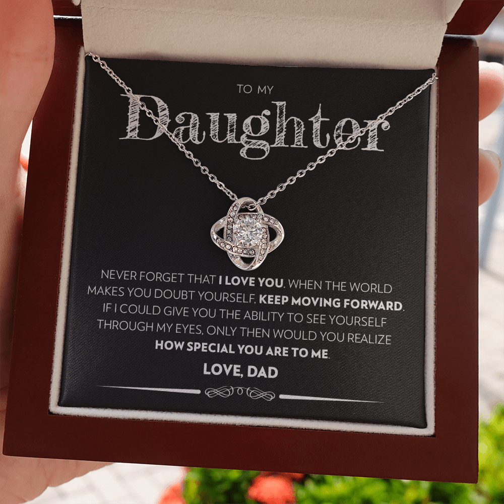Mahogany style box with LED light holding the love knot pendant necklace in 14k white gold finish and the "To My Daughter" message card from Dad (Keep Moving Forward)